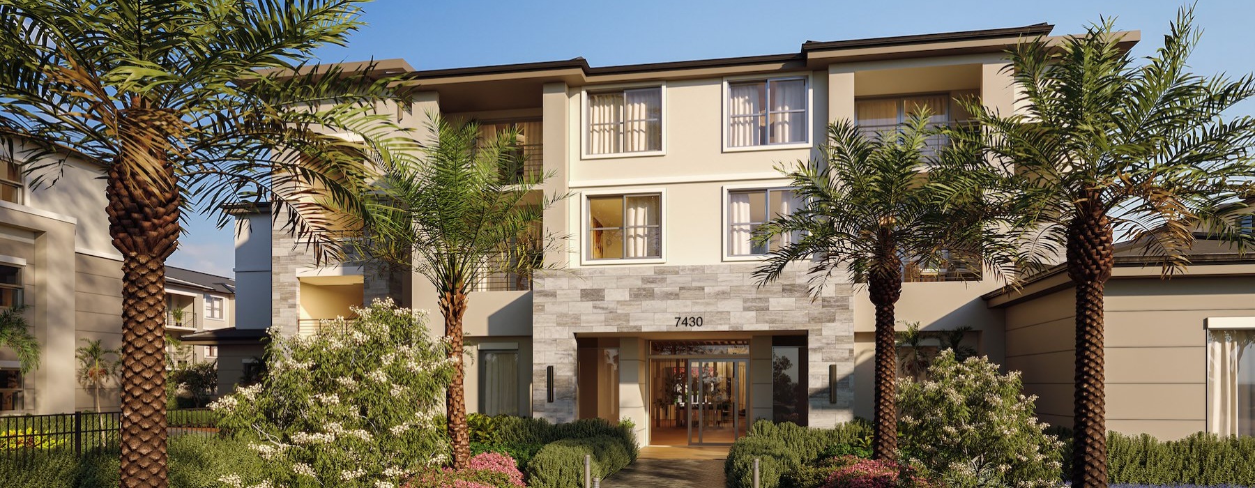 front of a building with a walkway and palm trees